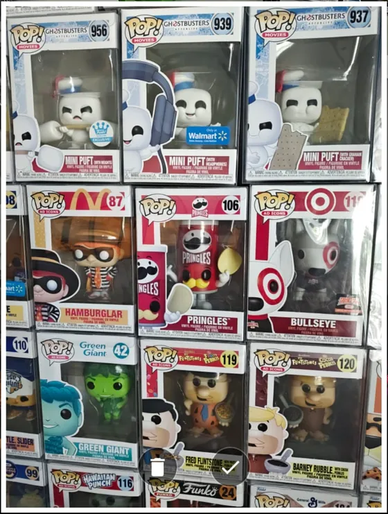 A phone photo of a shelf of boxed Funko Pops
